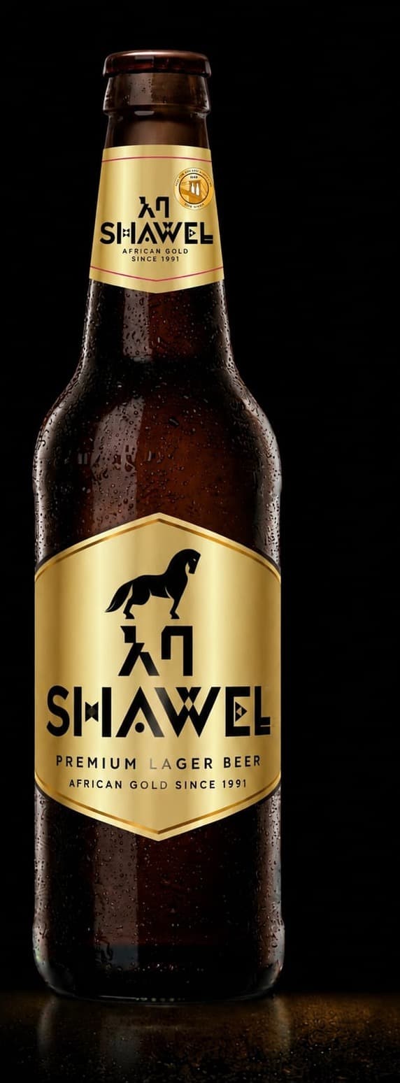 Shawel Premium Lager, African Gold since 1991, a dark bottle with a gold hexagon label